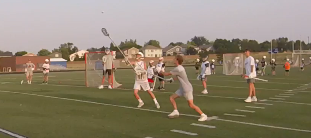 Two Lacrosse Players going for a pass at  The Summer Showdown Lacrosse Camp in San Antonio, Texas 